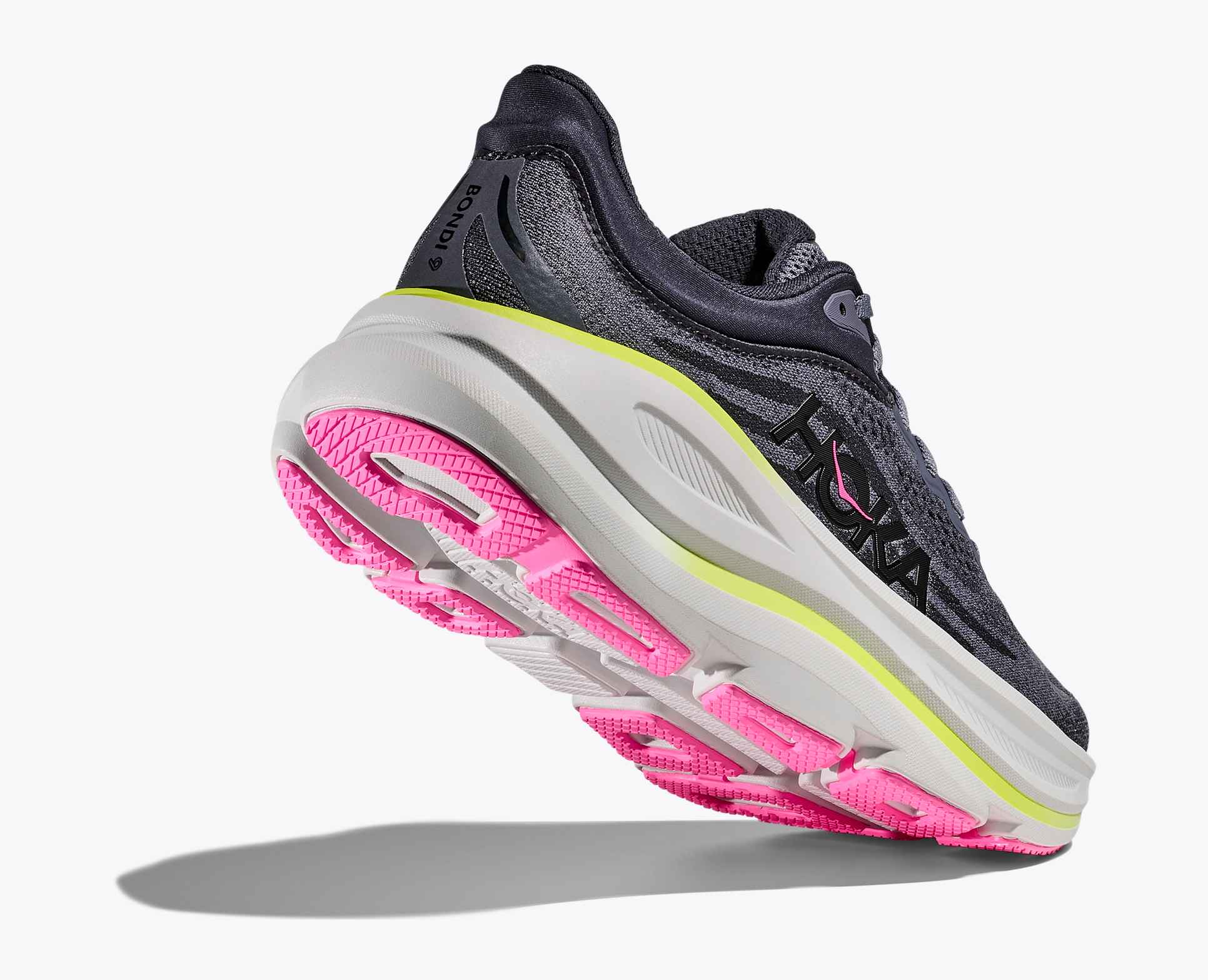 grey hoka bondi running shoes with pink and green accents with pink sole