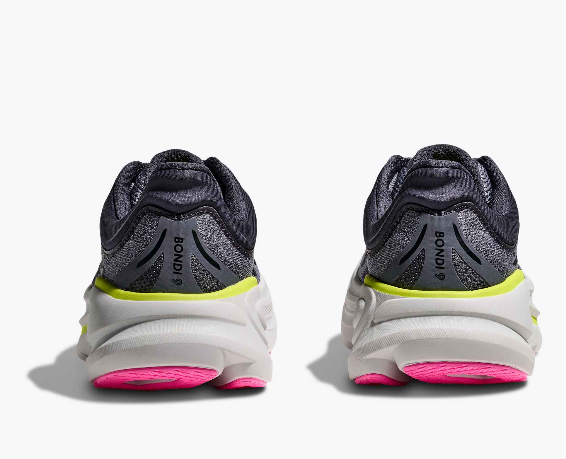 Pair grey hoka bondi running shoes with pink and green accents on the heels 