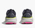 Pair grey hoka bondi running shoes with pink and green accents on the heels 