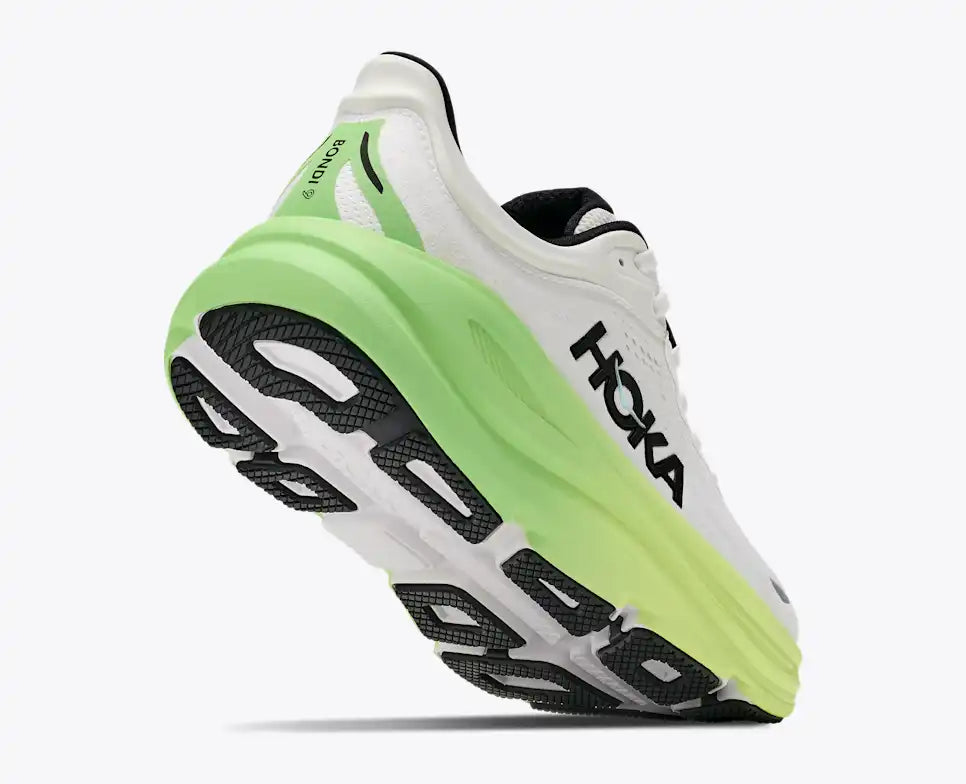 hoka bondi 9 womens, super cushioned road running and walking shoe, white colour with green and yellow sole, picture of shoe on white background.