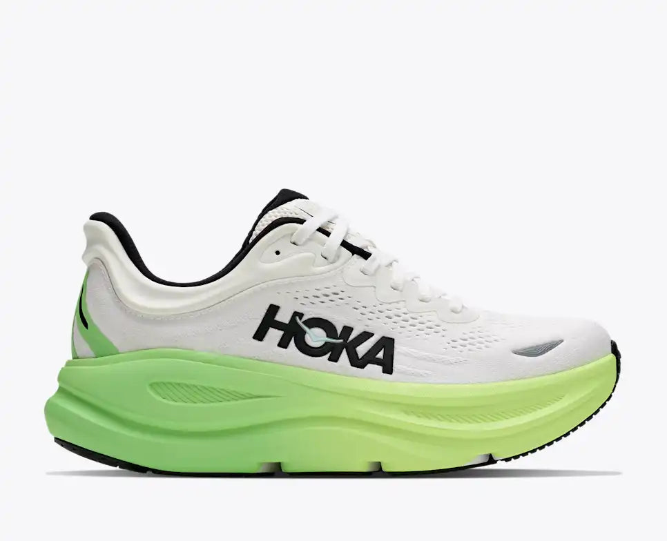 hoka bondi 9 womens, super cushioned road running and walking shoe, white colour with green and yellow sole, picture of shoe on white background.