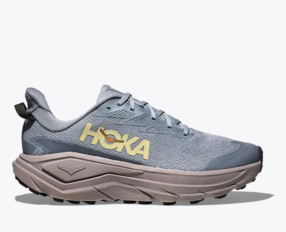 hoka challenger 8 gtx for men, waterproof gravel road to trail running and walking shoe, light grey blue with grey sole colour and yellow logo, side profile of shoe