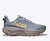 hoka challenger 8 gtx for men, waterproof gravel road to trail running and walking shoe, light grey blue with grey sole colour and yellow logo, side profile of shoe