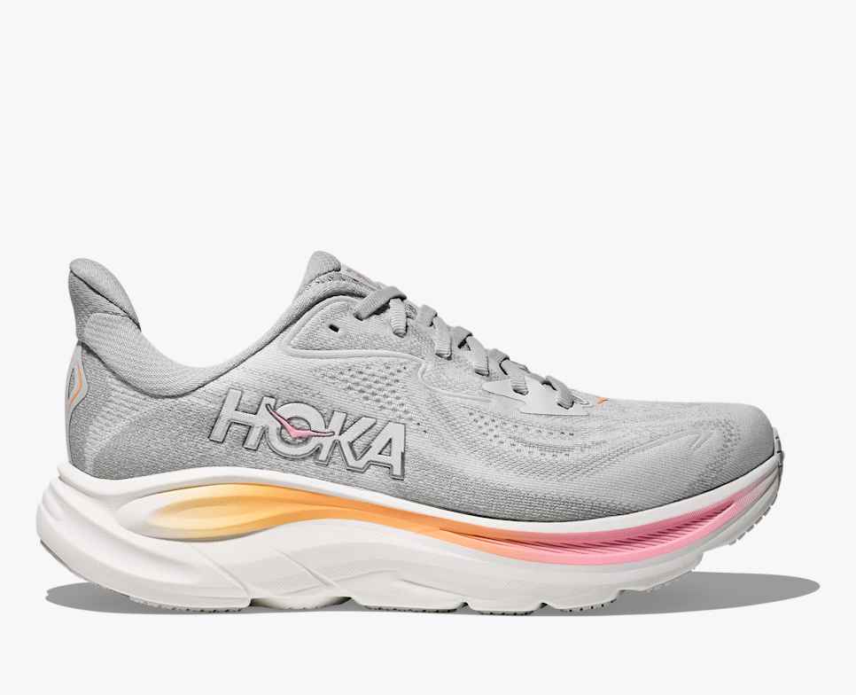 hoka clifton 10 womens, lightweight everyday running shoe, light grey colour with pink and orange details on white sole, side profile