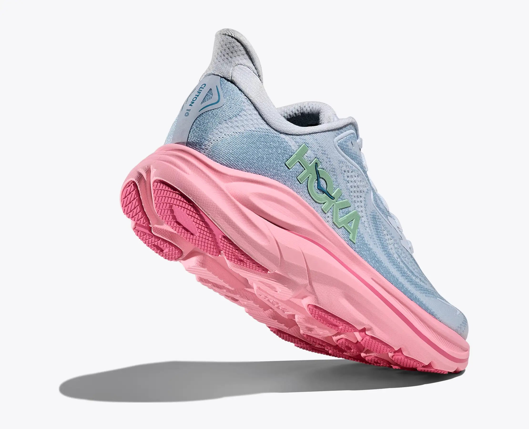 hoka clifton 10 for women, lightweight cushioned road running and walking shoe, light blue colour with pink sole, heel of shoe lifted showing underneath shoe