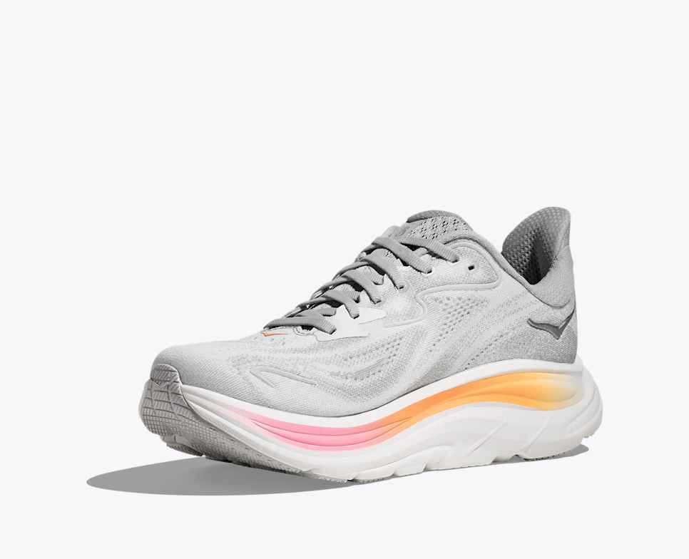 hoka clifton 10 womens, lightweight everyday running shoe, light grey colour with pink and orange details on white sole, side profile angle