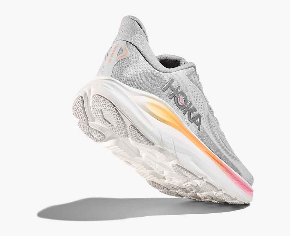 hoka clifton 10 womens, lightweight everyday running shoe, light grey colour with pink and orange details on white sole, lifted heel