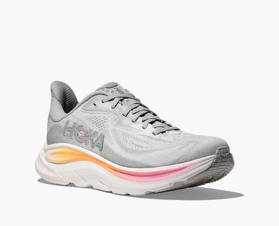 hoka clifton 10 womens, lightweight everyday running shoe, light grey colour with pink and orange details on white sole, side profile angle