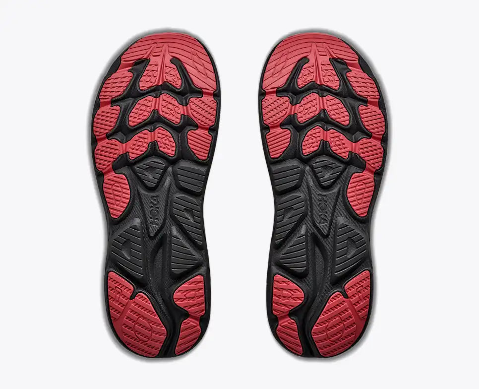 Hoka Clifton 11 GORE-TEX mens in a grey upper with a black sole and red details on the laces and sole. The Clifton 11 GORE-TEX® is engineered to seal out the elements with a GORE-TEX® Invisible Fit membrane, closed mesh upper, and water-repellant coating. View of the sole of both shoes.