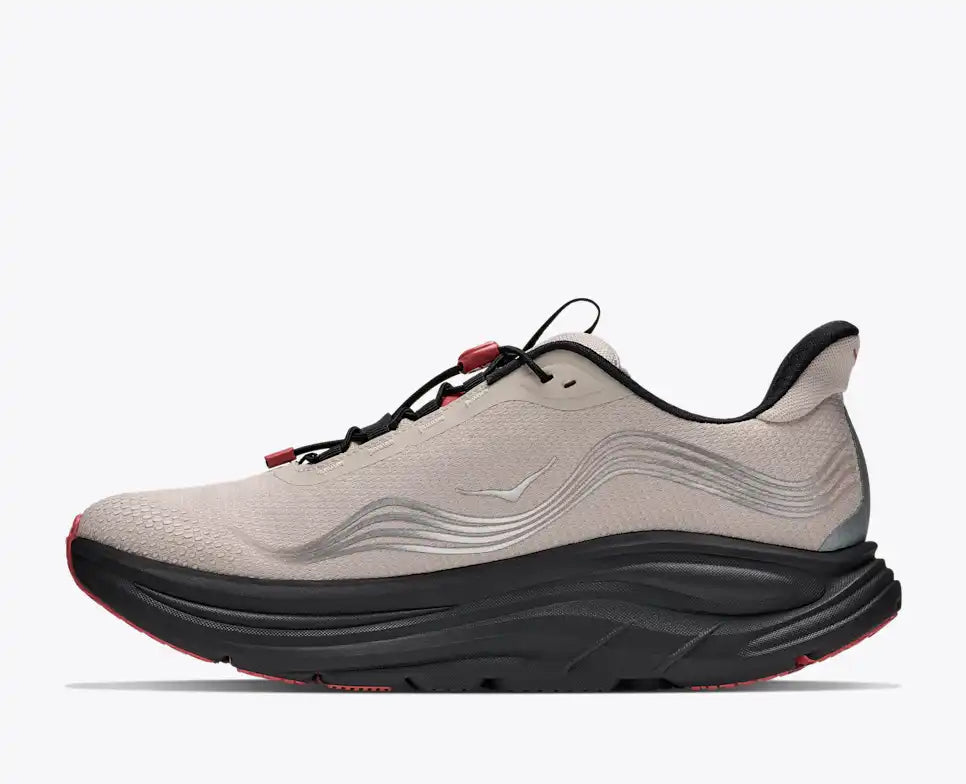 Hoka Clifton 11 GORE-TEX mens in a grey upper with a black sole and red details on the laces and sole. The Clifton 11 GORE-TEX® is engineered to seal out the elements with a GORE-TEX® Invisible Fit membrane, closed mesh upper, and water-repellant coating. Inside side profile of shoe.