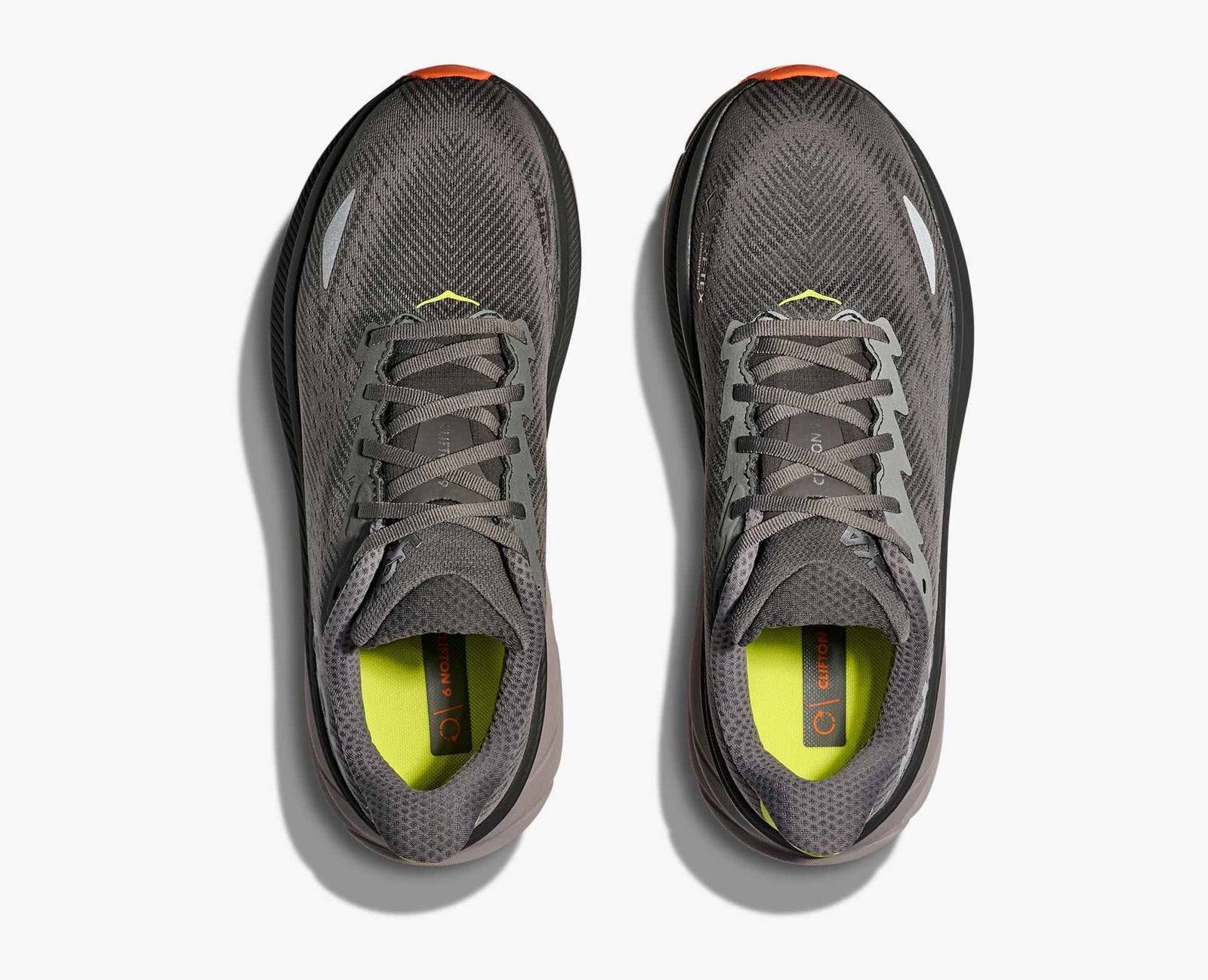 Dark grey hoka mens waterproof running shoe with orange sole overview