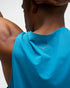 hoka everyrun tank top for men, light breathable running singlet , bright blue colour with silver reflective HOKA logo, close up of a man wearing hoka tank from the back