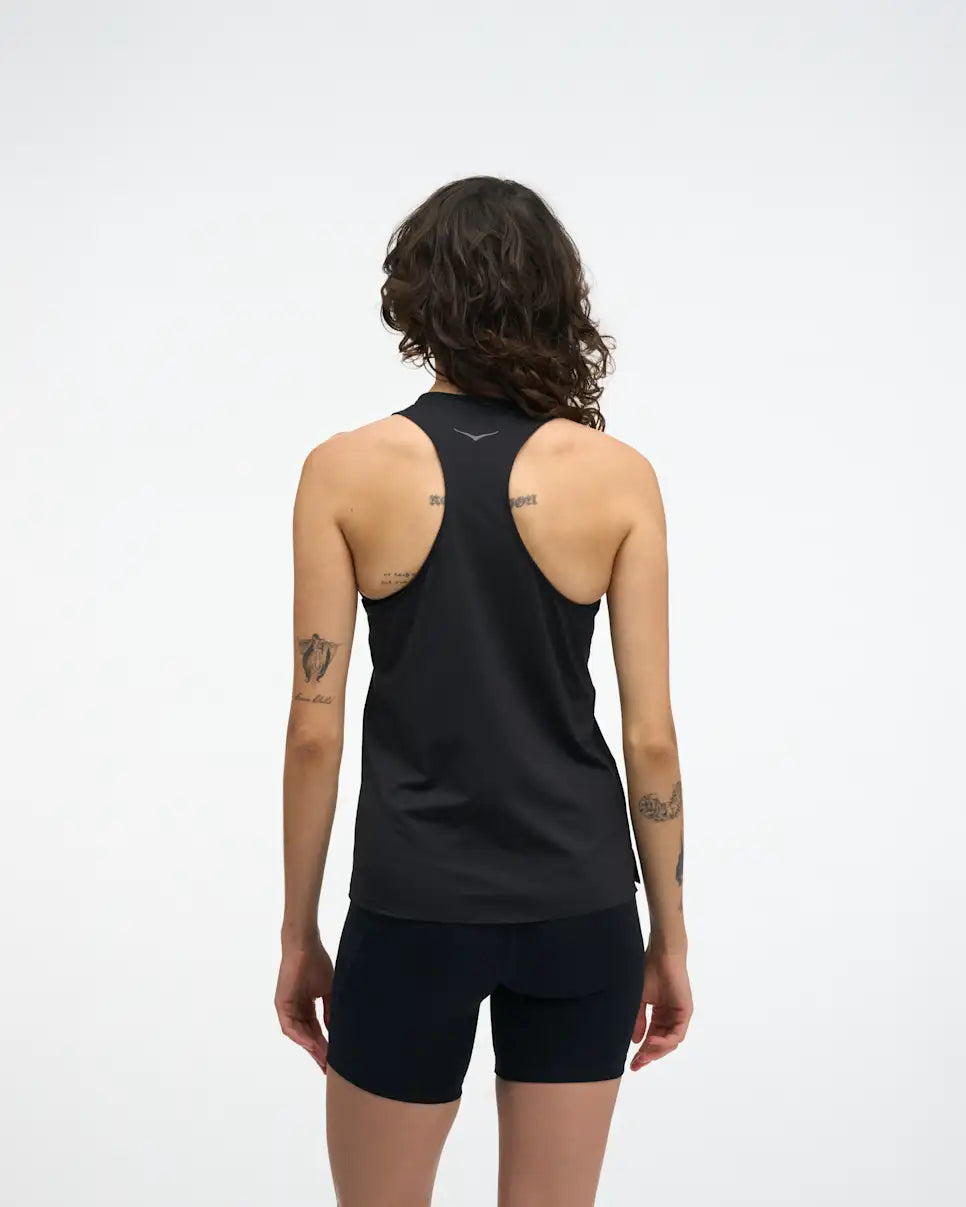 hoka everyrun womens tank in black. The  ultralight tank is tuned for daily training with comfort-first design details. Cut from our breathable, quick-dry FlyLite™ material, the slim-fit silhouette wicks sweat to keep you dry from first mile to last.