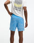 HOKA Glide 7'' Short 2-in-1, lightweight running short with inner short, light blue with white line design, back of man wearing shorts and white 'fly human fly' shirt