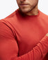 Man wearing hoka long sleeve run top in rusty red colour, close up of fabric