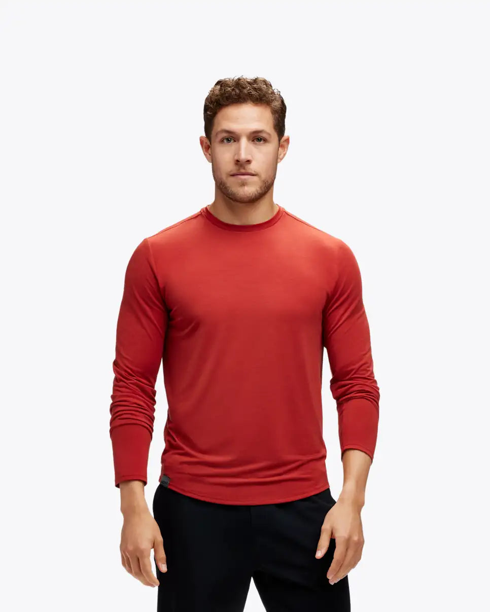Man wearing hoka long sleeve running top in red colour