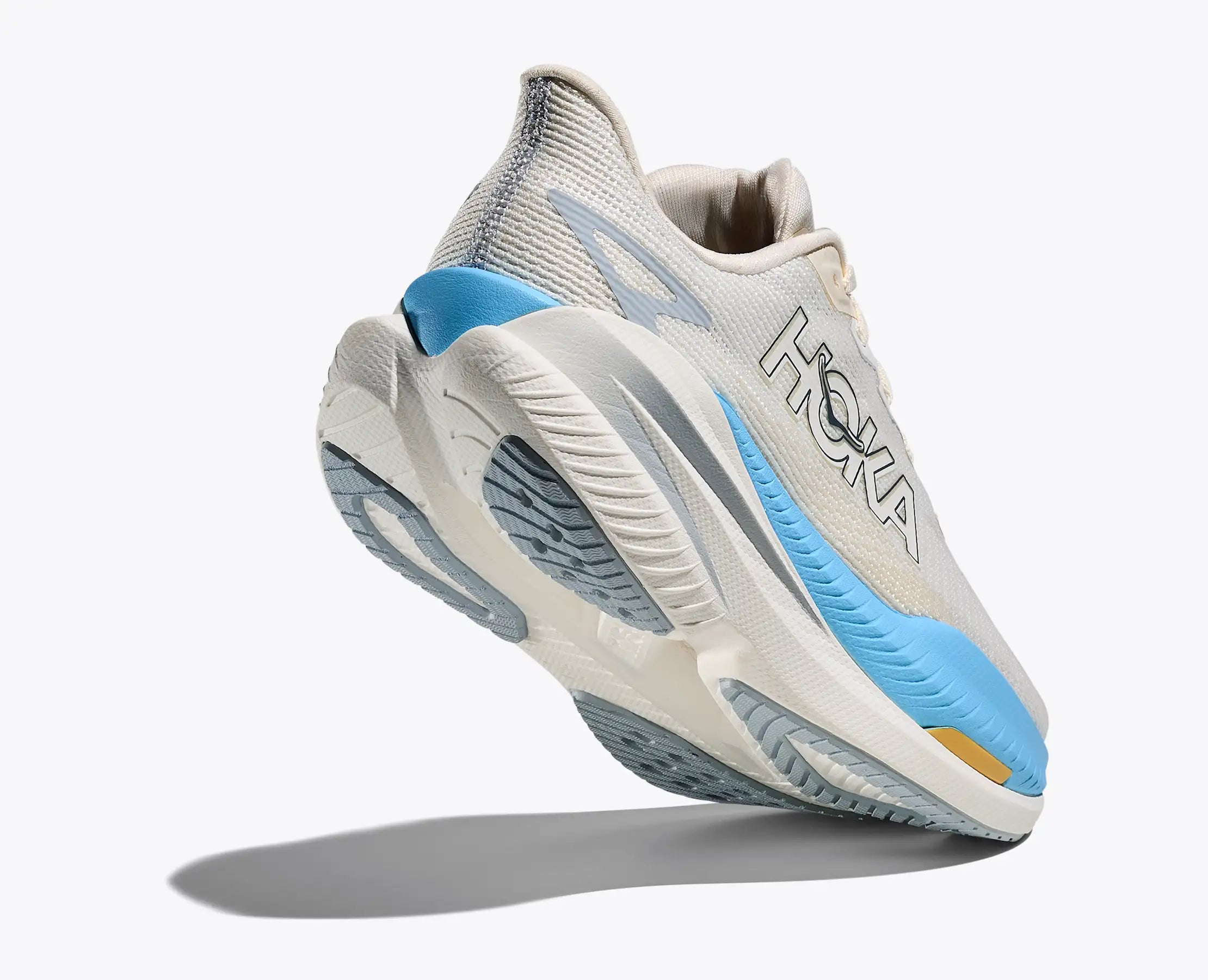 hoka mach x 3 for women, pebax plated speed and tempo running shoe, white with blue details, shoe with lifted heel showing sole 