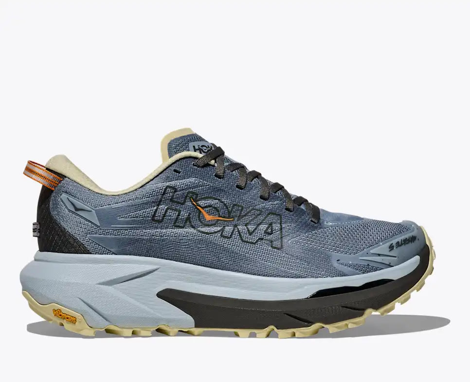 hoka mafate 5 for men, super cushioned trail running shoe with vibram grip, light greyish blue with black sole, side profile of shoe