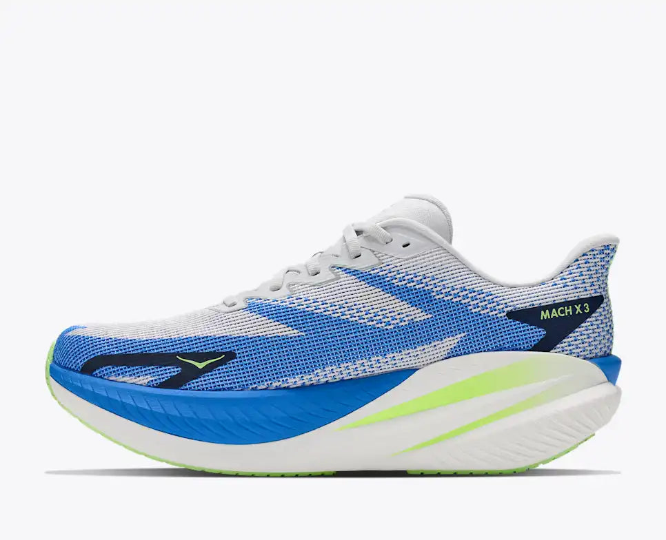 side view of mens mach x 3 road running shoe in a white colour with blue and green accents 