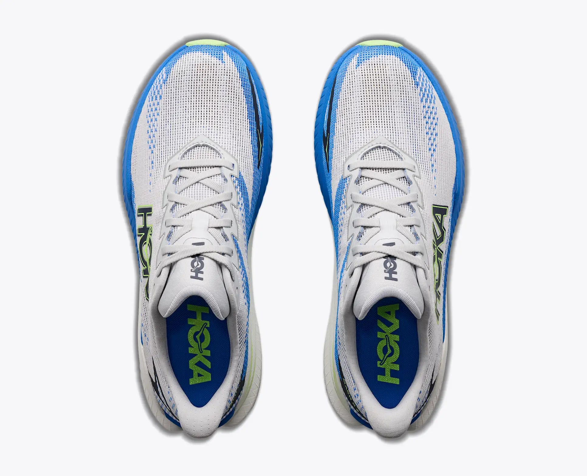 top view of mens mach x 3 road running shoe in a white colour with blue and green accents 