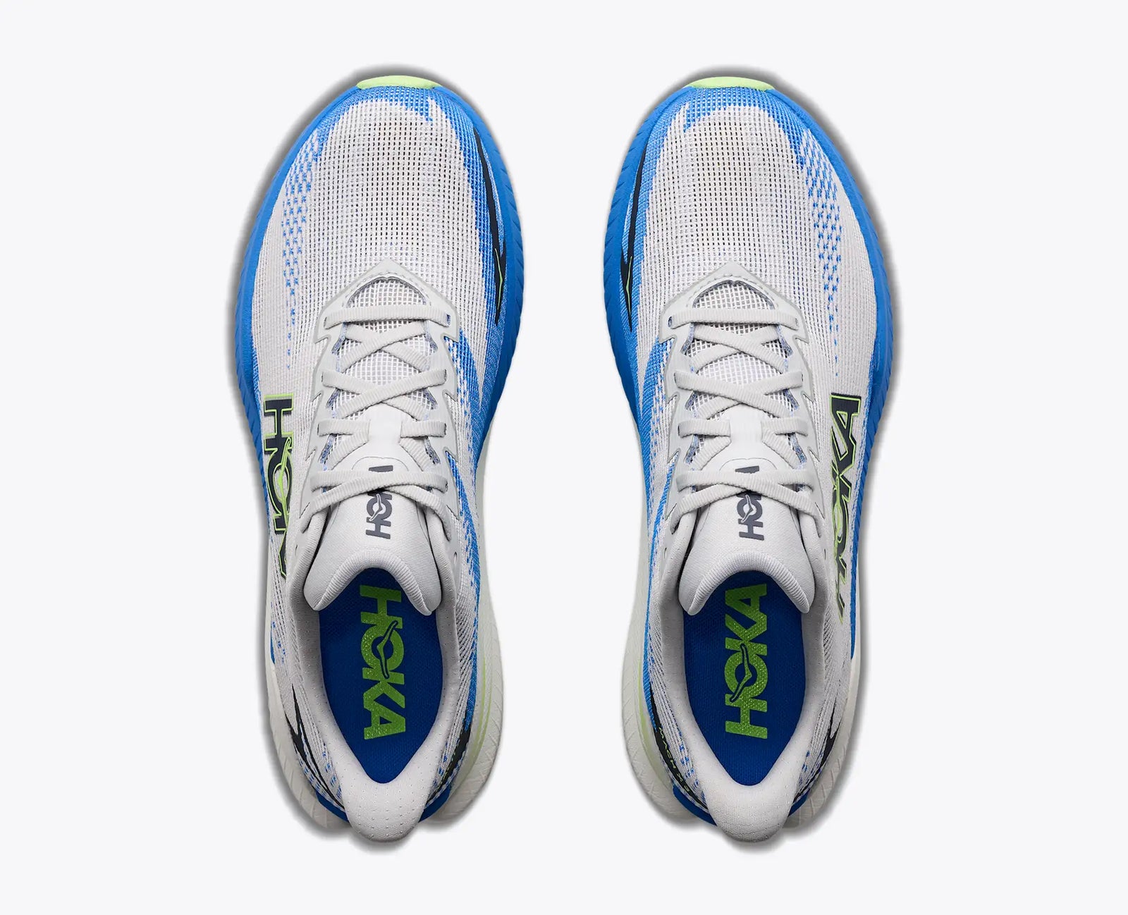 top view of mens mach x 3 road running shoe in a white colour with blue and green accents 
