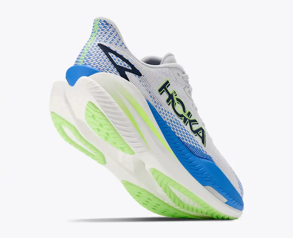 lifted heel view of mens mach x 3 road running shoe in a white colour with blue and green accents 