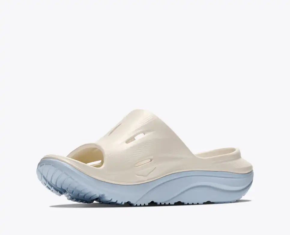 hoka ora recovery slide for all gender, comfortable and supportive slider for after run recovery, cream colour, side profile of ora slide on a white background