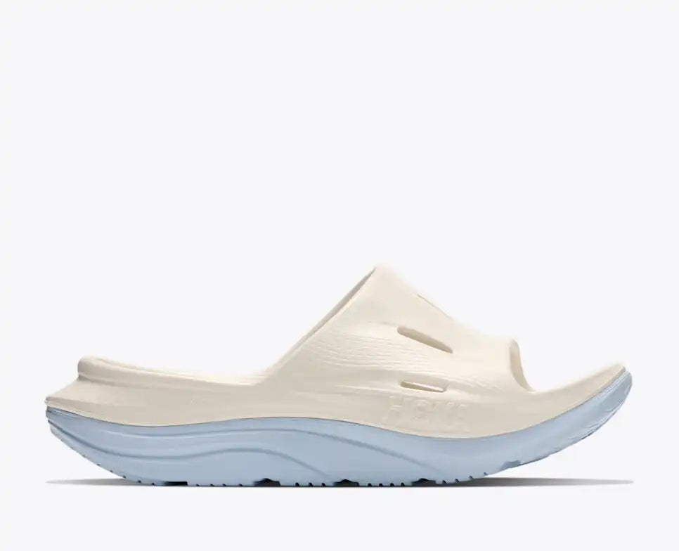 hoka ora recovery slide for all gender, comfortable and supportive slider for after run recovery, cream colour, side profile of ora slide on a white background