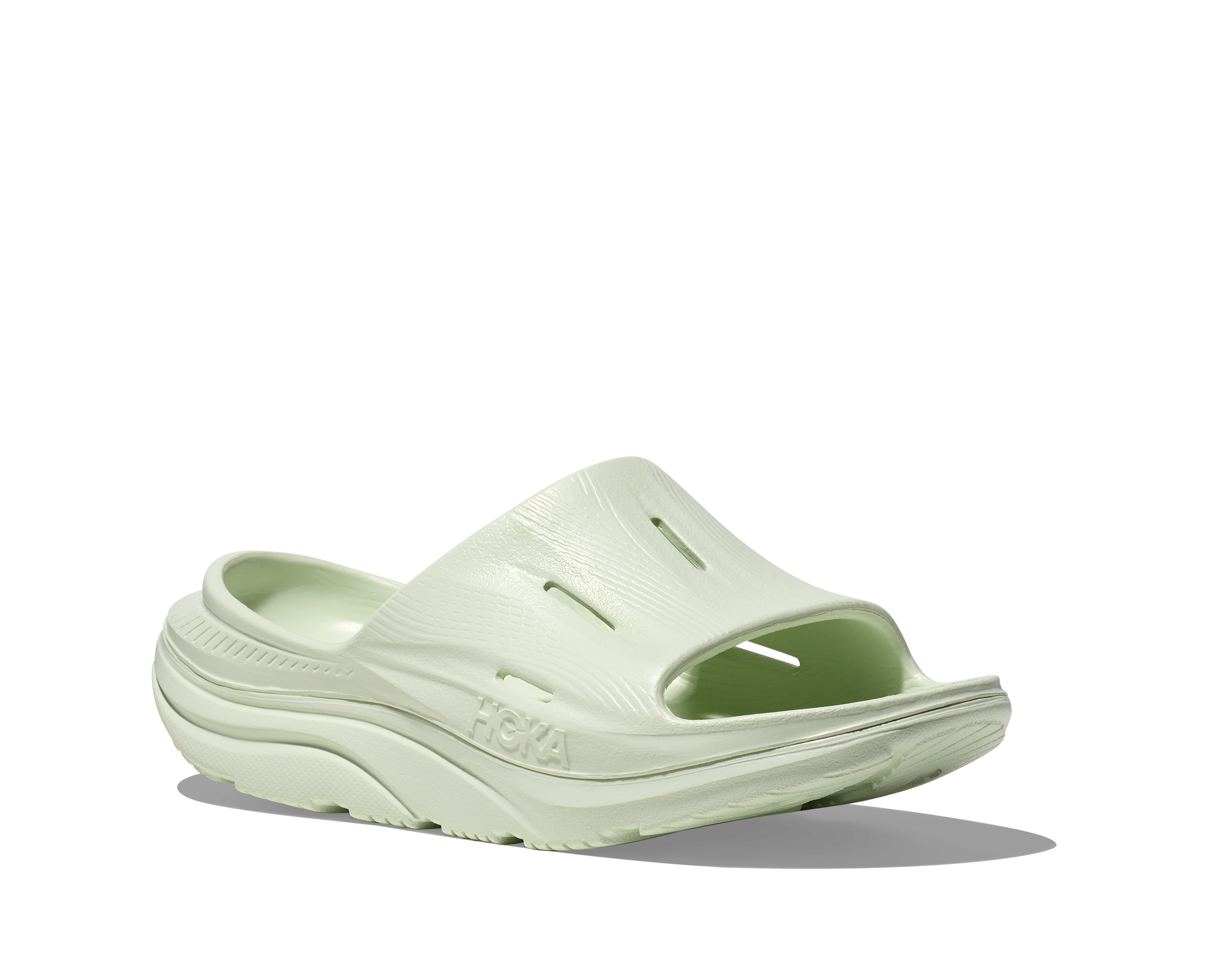 hoka ora recovery slide for all gender, comfortable and supportive slider for after run recovery, light green colour, side profile of ora slide on a white background
