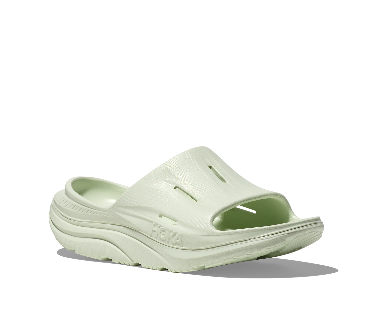 hoka ora recovery slide for all gender, comfortable and supportive slider for after run recovery, light green colour, side profile of ora slide on a white background