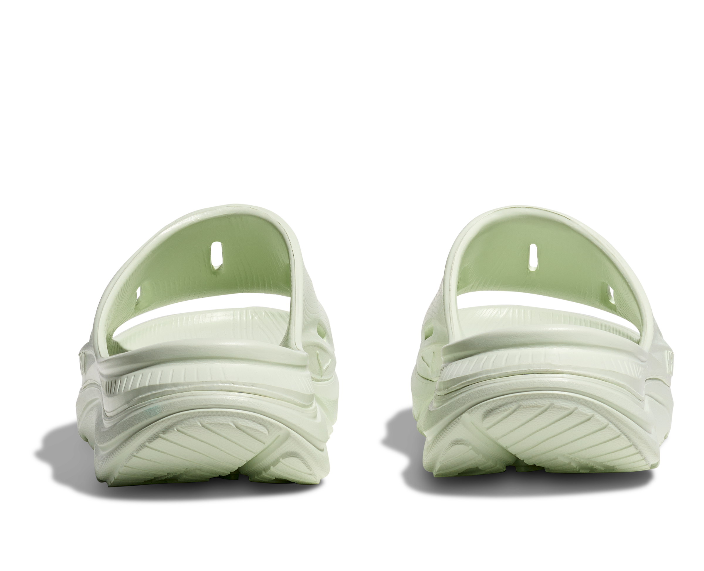 hoka ora recovery slide for all gender, comfortable and supportive slider for after run recovery, light green colour, back profile of ora slide on a white background
