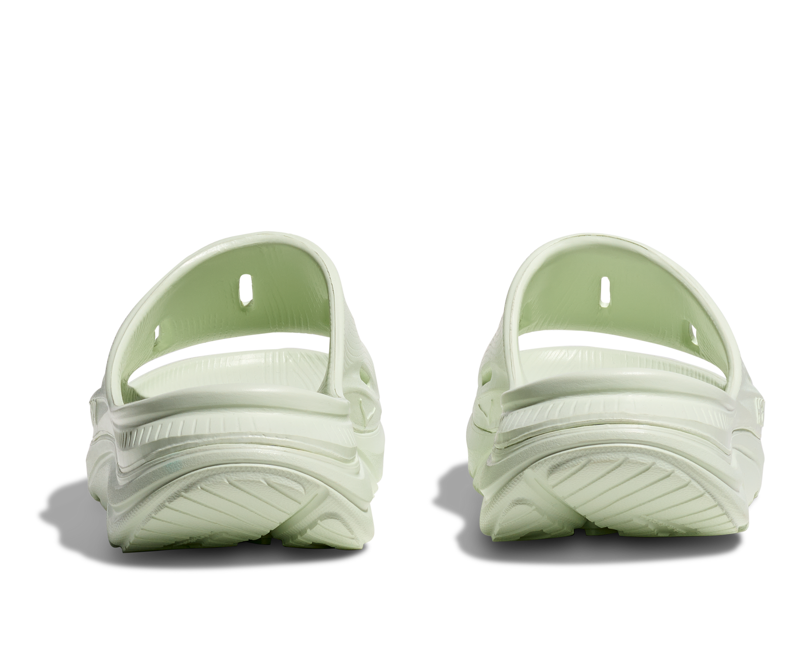 hoka ora recovery slide for all gender, comfortable and supportive slider for after run recovery, light green colour, back profile of ora slide on a white background