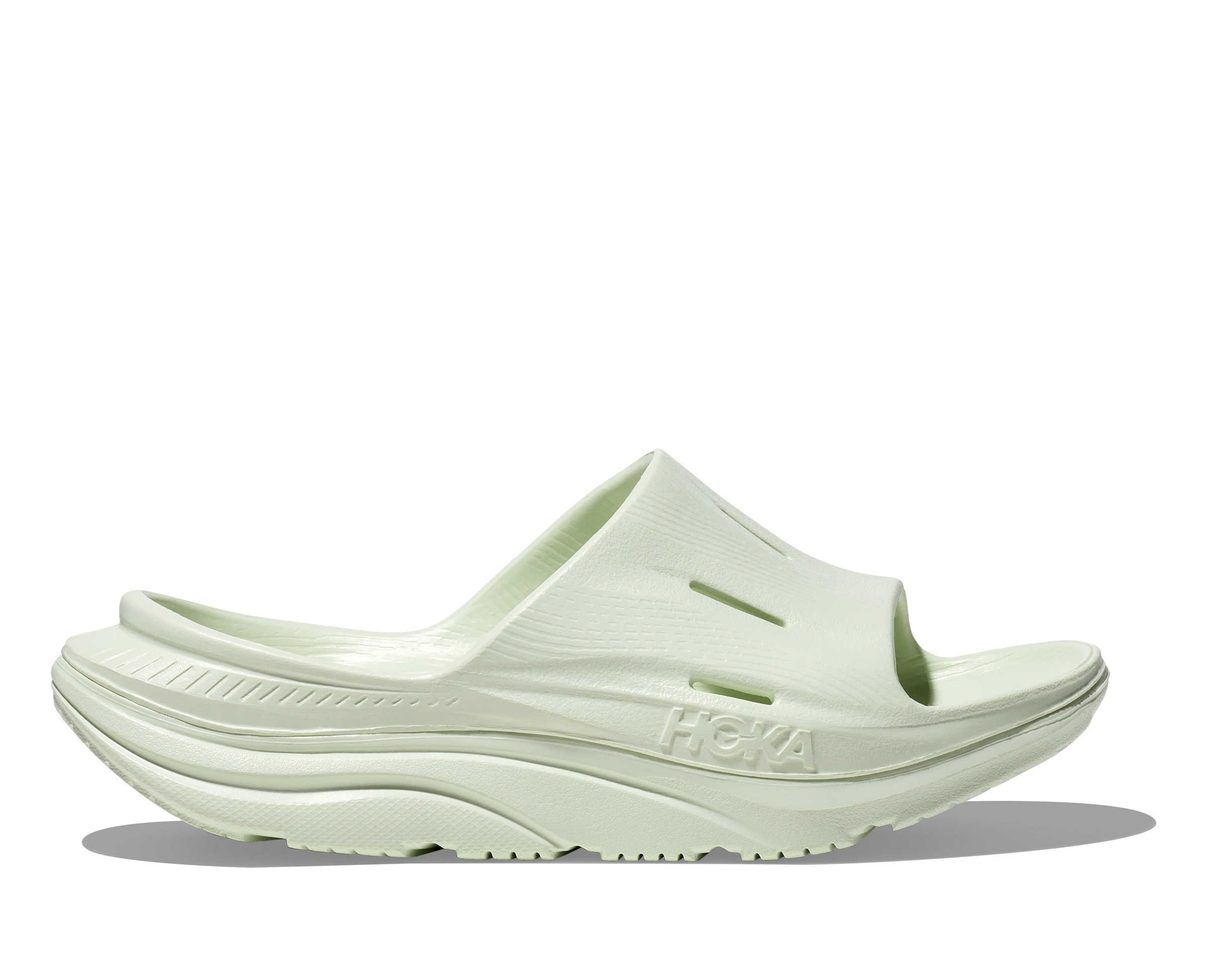hoka ora recovery slide for all gender, comfortable and supportive slider for after run recovery, light green colour, profile of ora slide on a white background