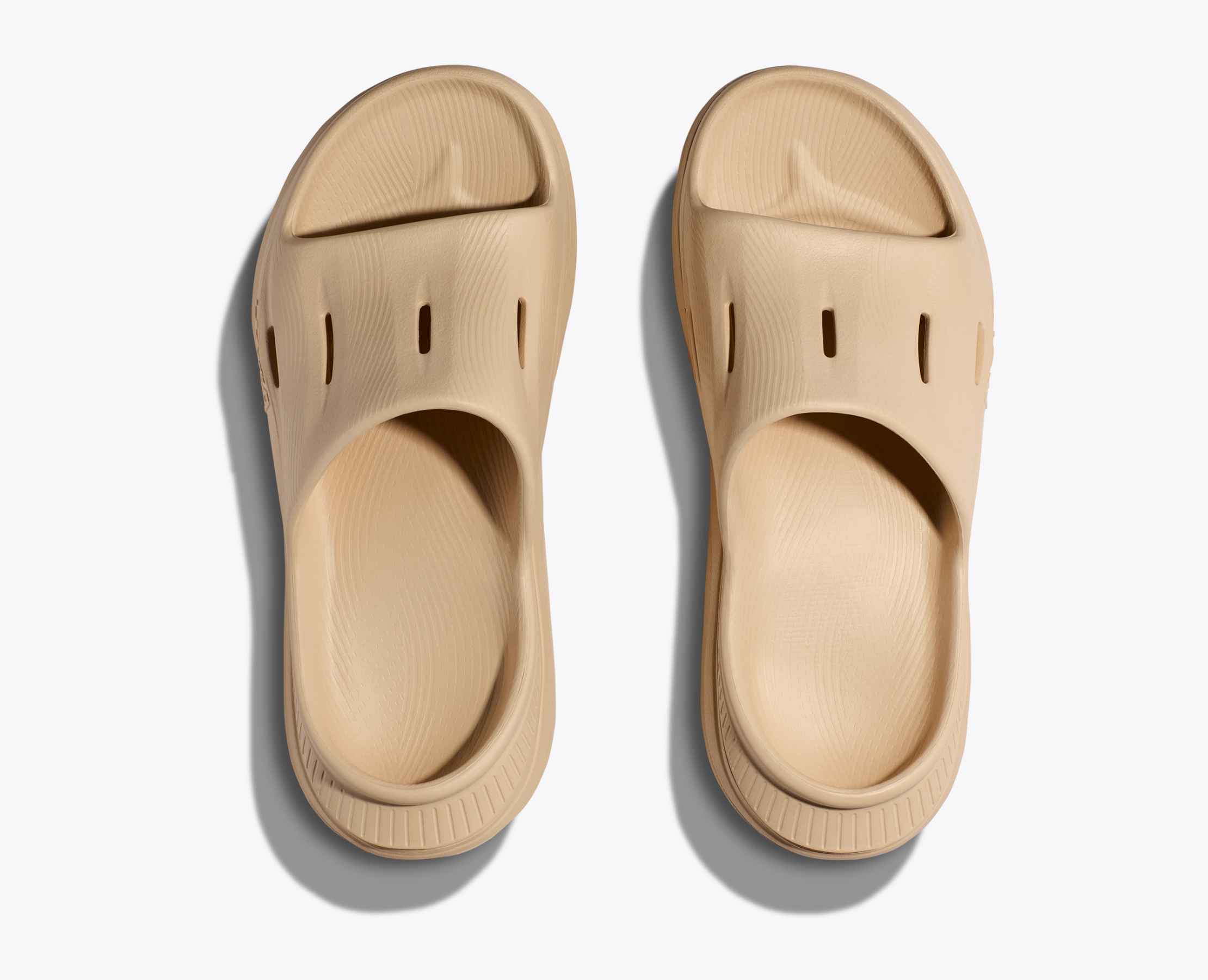 Pair of beige sandal hoka ora recovery slide for after run comfort 