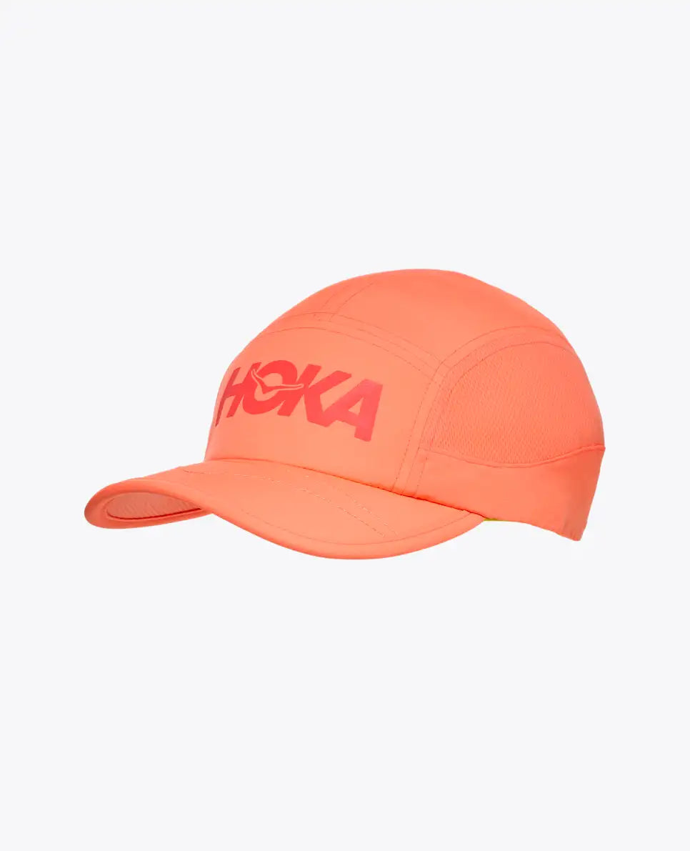hoka running cap for all gender, lightweight breathable running cap, peach colour with red hoka logo, cap shown on a white background