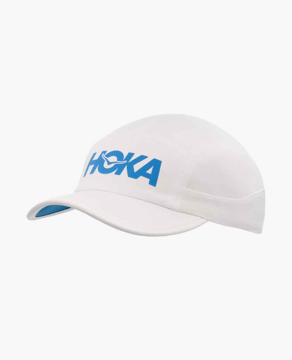 hoka run hat, breathable soft running hat with reflective detail, white hat with blue 'hoka' logo