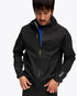 close up of man wearing hoka skybreeze waterproof jacket, light waterproof gtx jacket for running, black colour with reflective details