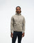 hoka men's skyglow half zip running top,  water resistant, stretchy long-sleeve pull over with a hood, light grey colour, front view of model wearing half-zip with black trousers on a white background