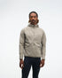 hoka men's skyglow half zip running top,  water resistant, stretchy long-sleeve pull over with a hood, light grey colour, front view of model wearing half-zip with black trousers on a white background