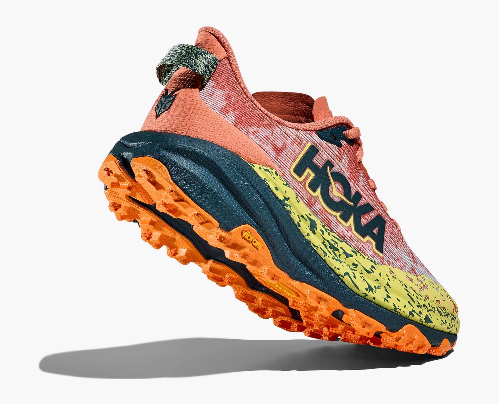 orange hoka running shoe with yellow and black details and black hoka logo