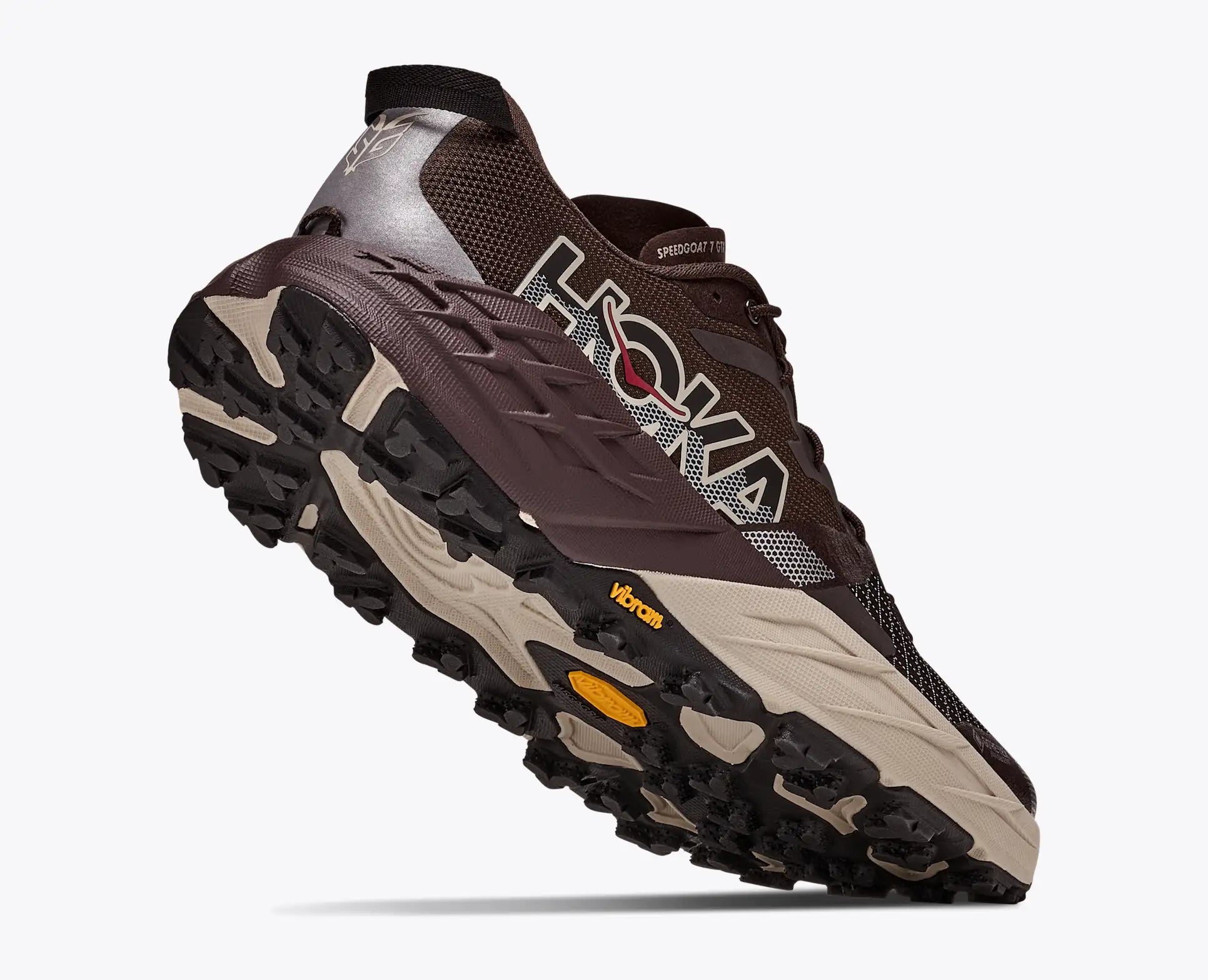 hoka speedgoat gtx 7 mens, waterproof technical trail shoe, brown with tan details, lifted heel of shoe