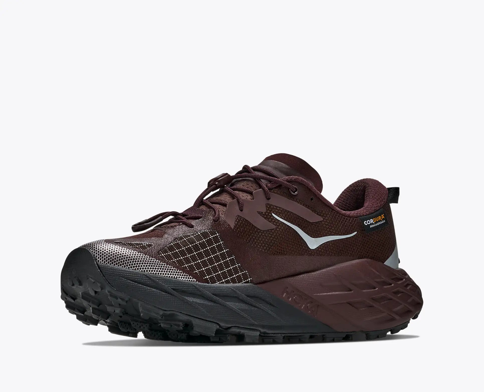 hoka speedgoat gtx 7 womens, waterproof technical trail shoe, brown with tan details, side angled profile of shoes
