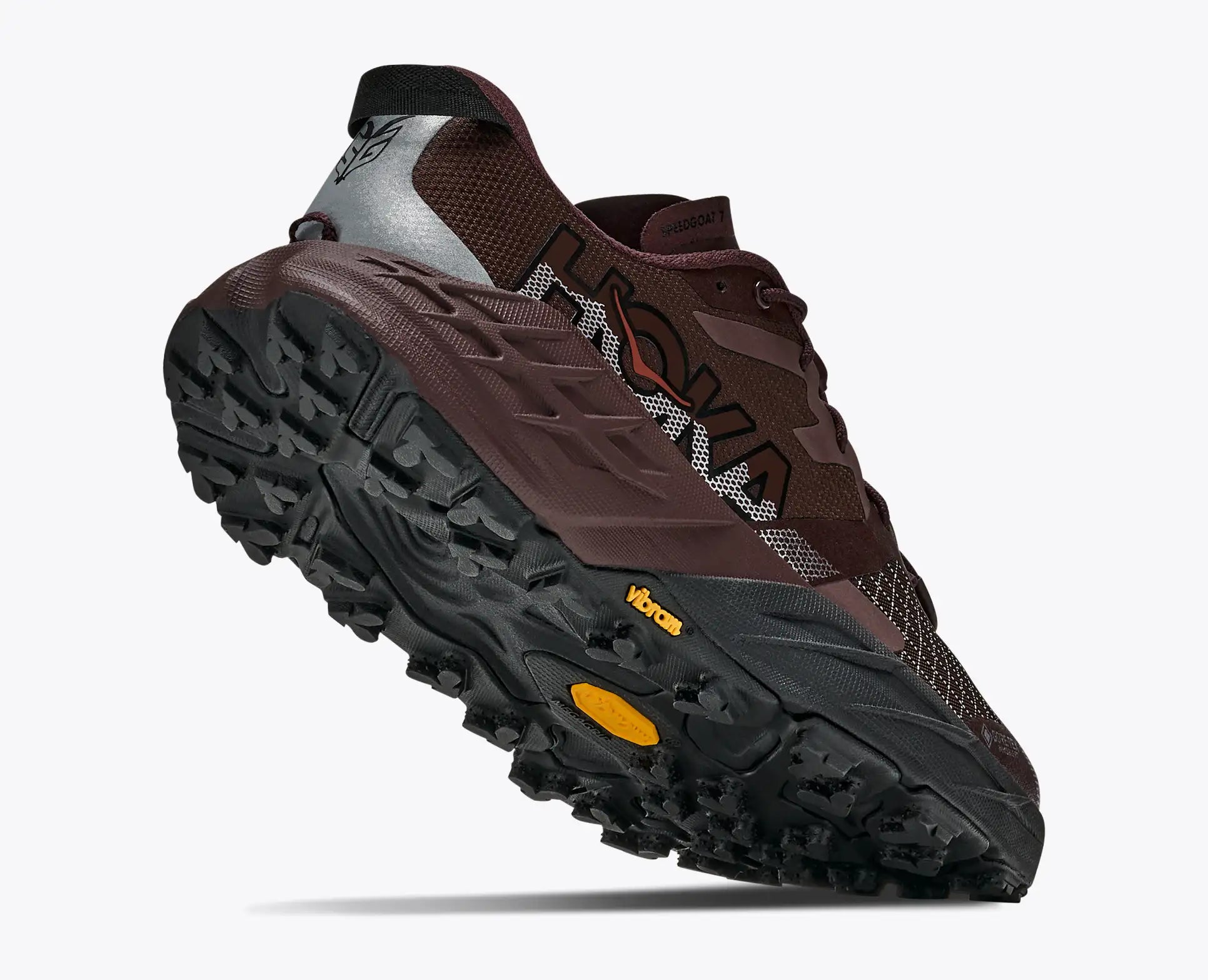 hoka speedgoat gtx 7 womens, waterproof technical trail shoe, brown with tan details, lifted heels of shoe