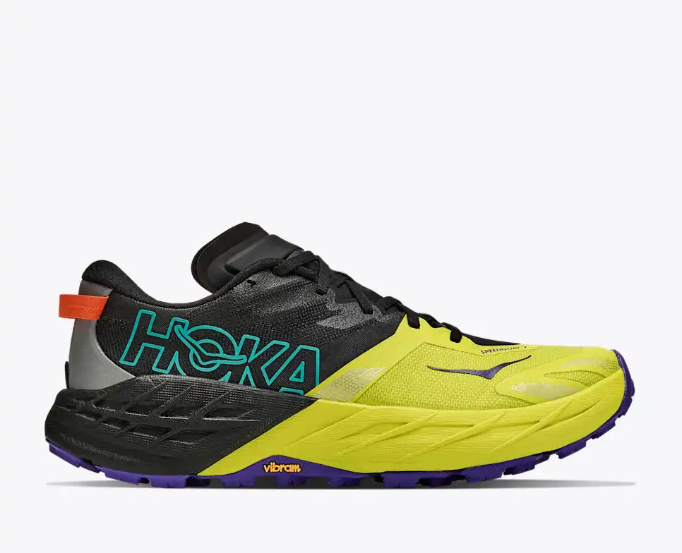 hoka sppedgoat 7, lightweight trail running shoe, yellow black with teal orange and purple details, side profile of shoe