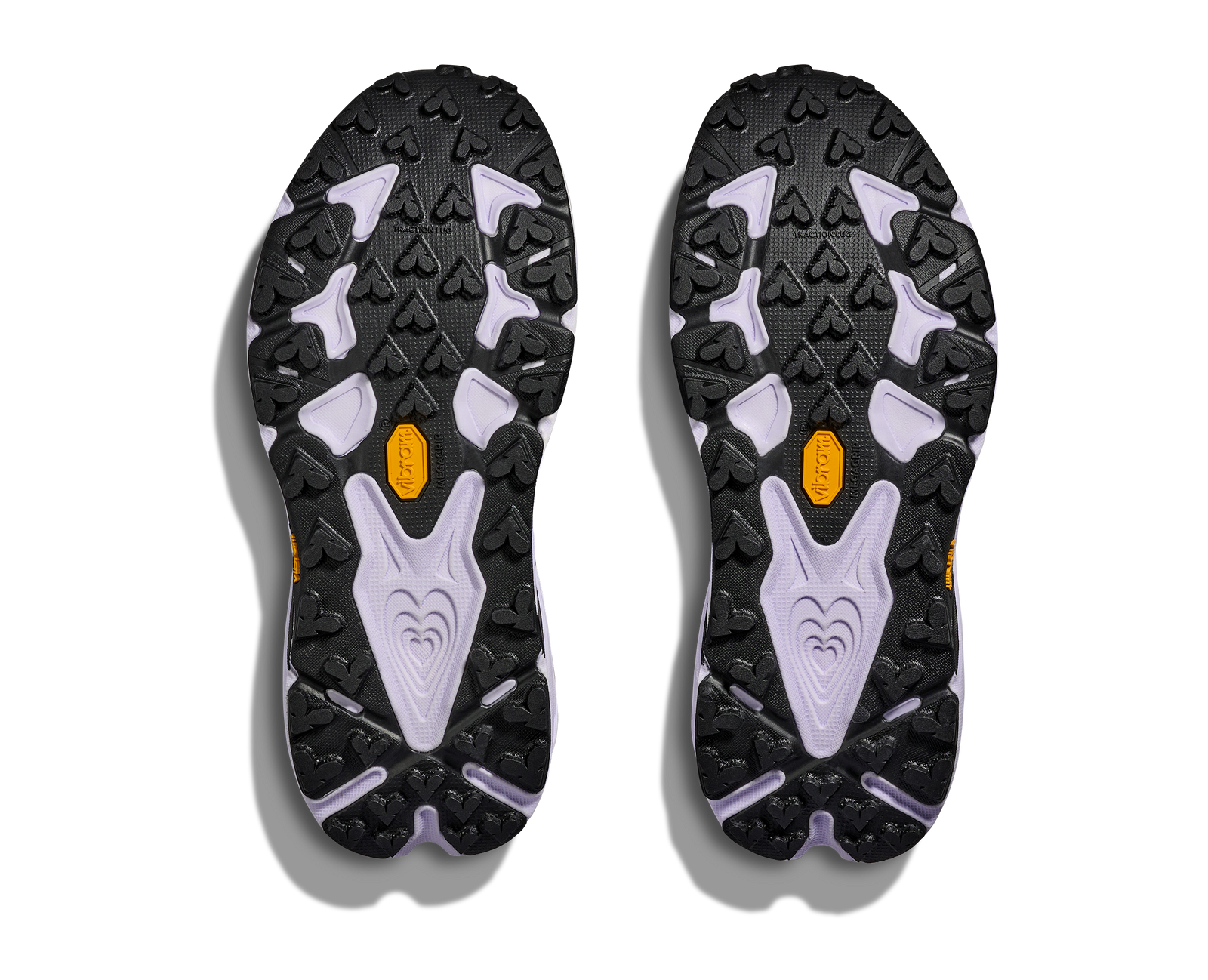 pair of hoka speedgoat 7 trail runner for women in berry jam and starlight glow colour, showing vibram grip sole and lugs