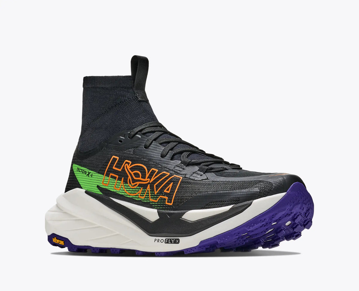 hoka tecton x 4 mens, carbon plated trail running and racing shoe, black with orange green and purple details, front angled profile of shoes