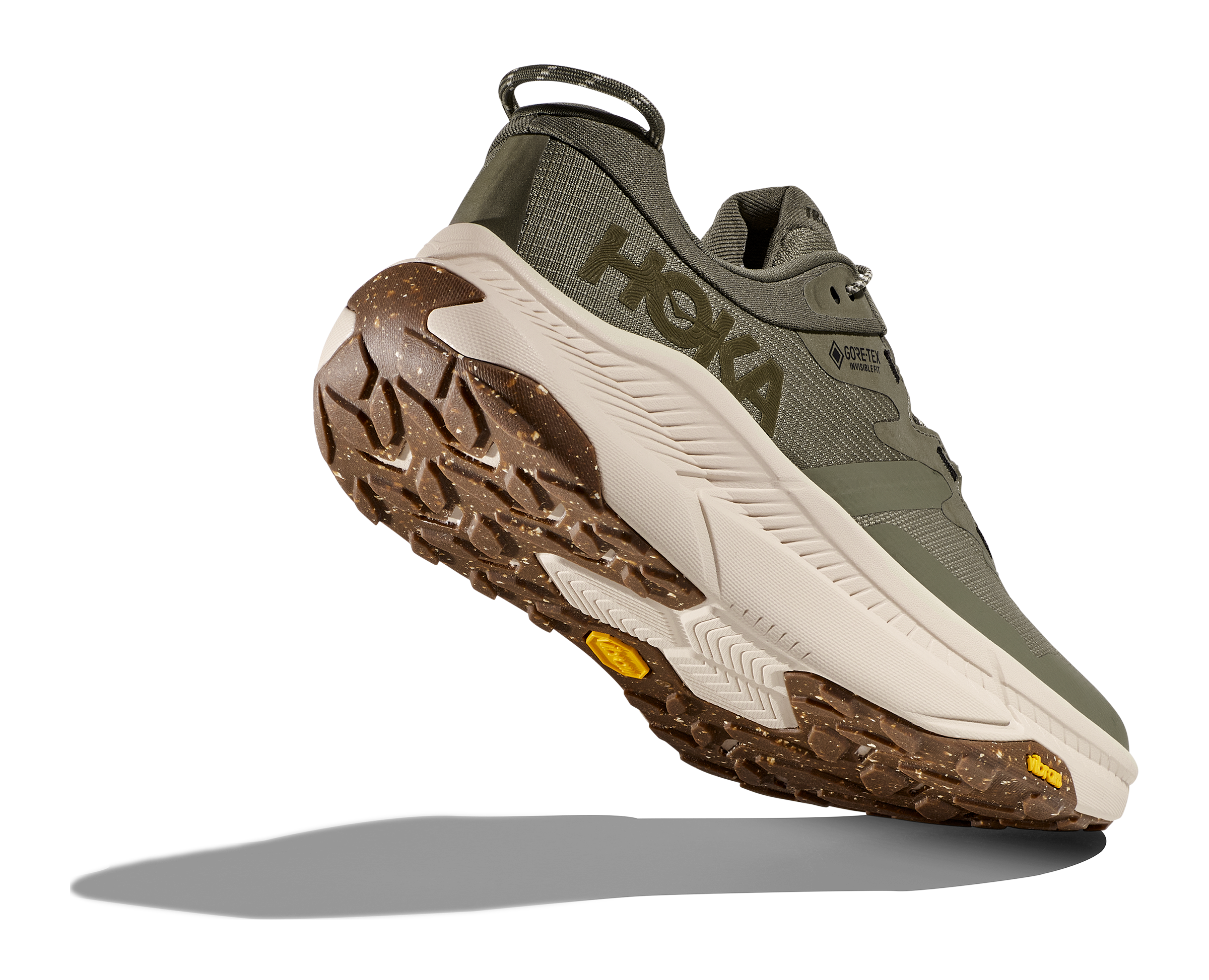 Dark green hoka hiking shoe with cream and brown sole