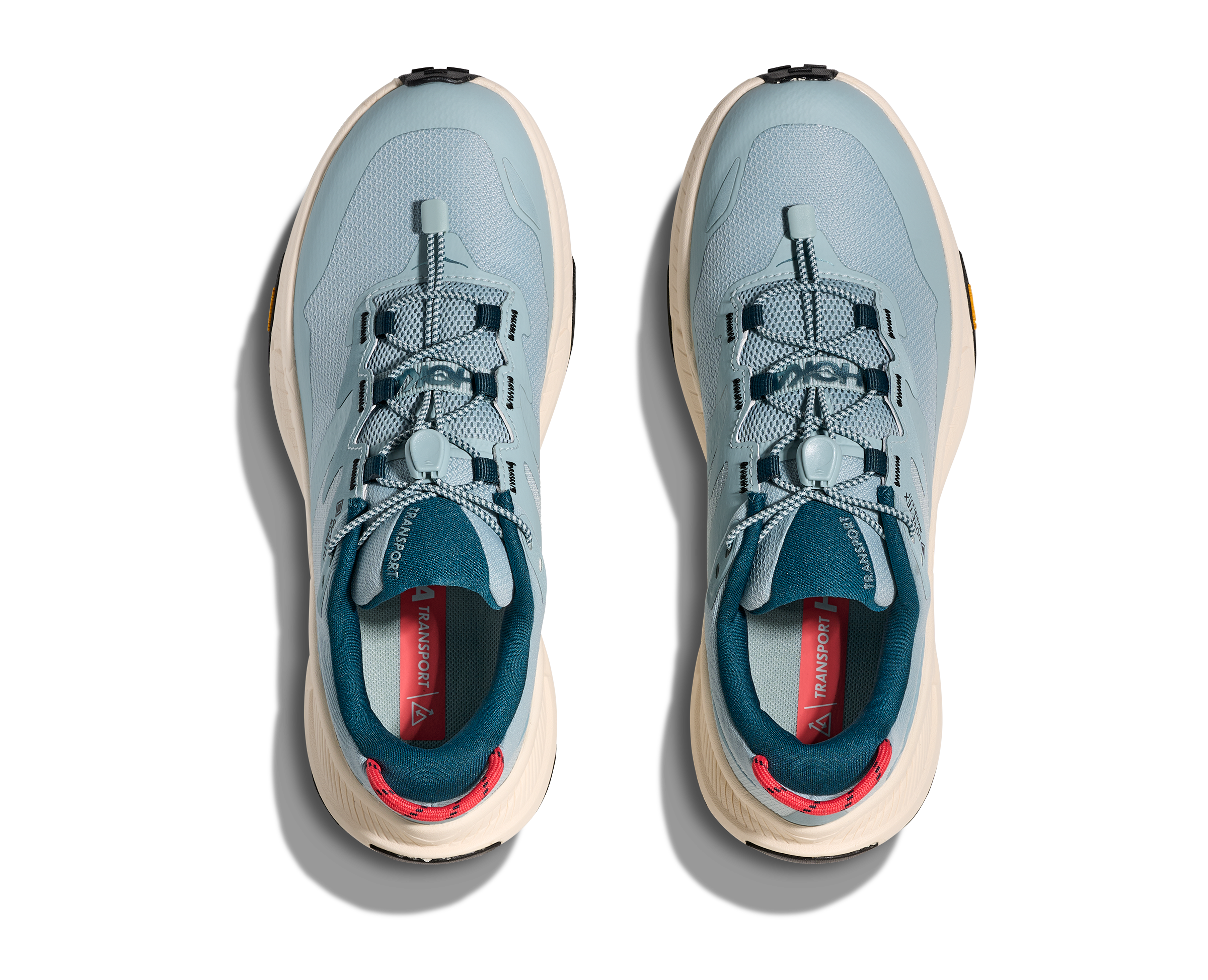 Light blue hoka hiking trail shoe for women with cream sole and red details overview