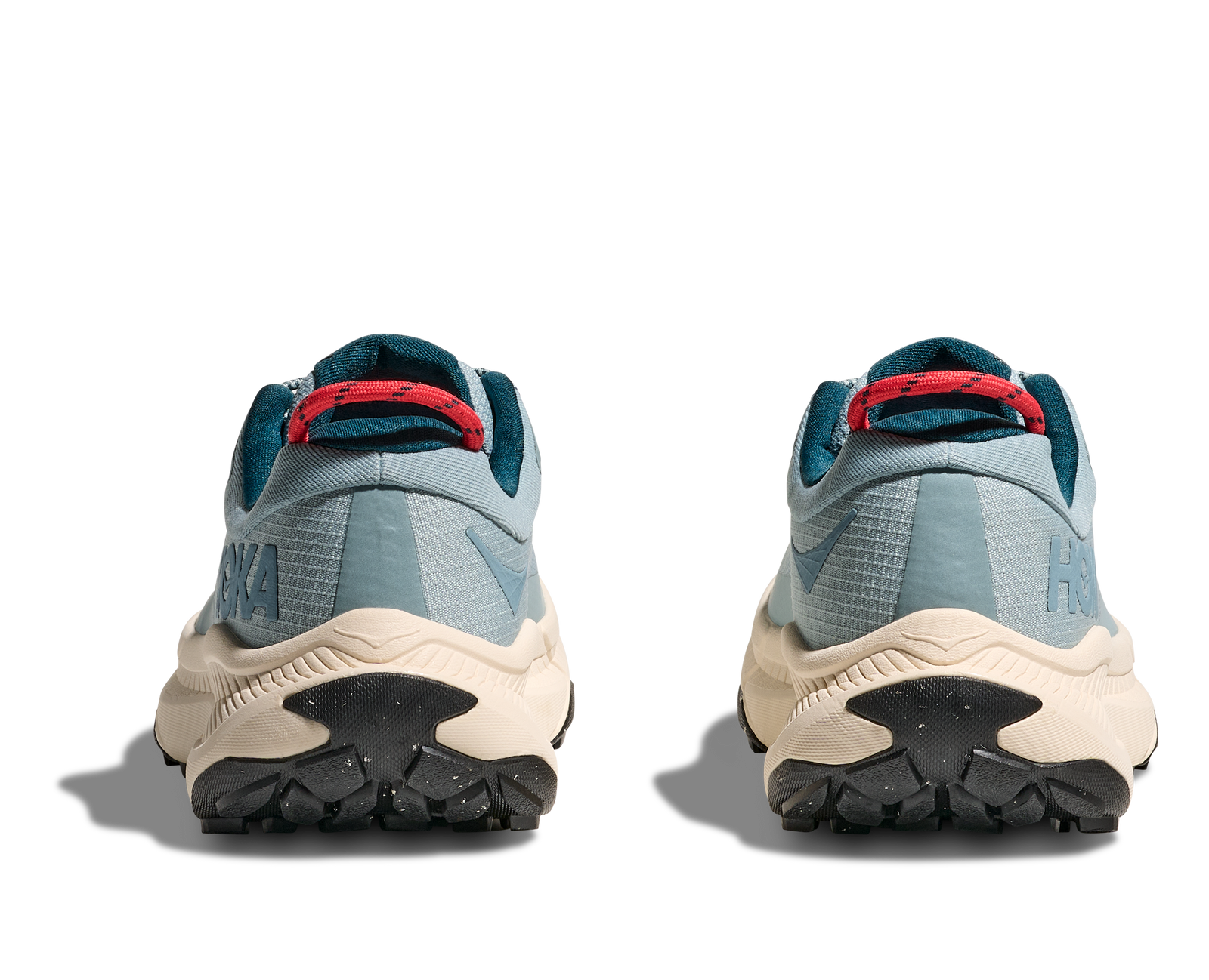 Light blue hoka hiking trail shoe for women with cream sole and red details on sole