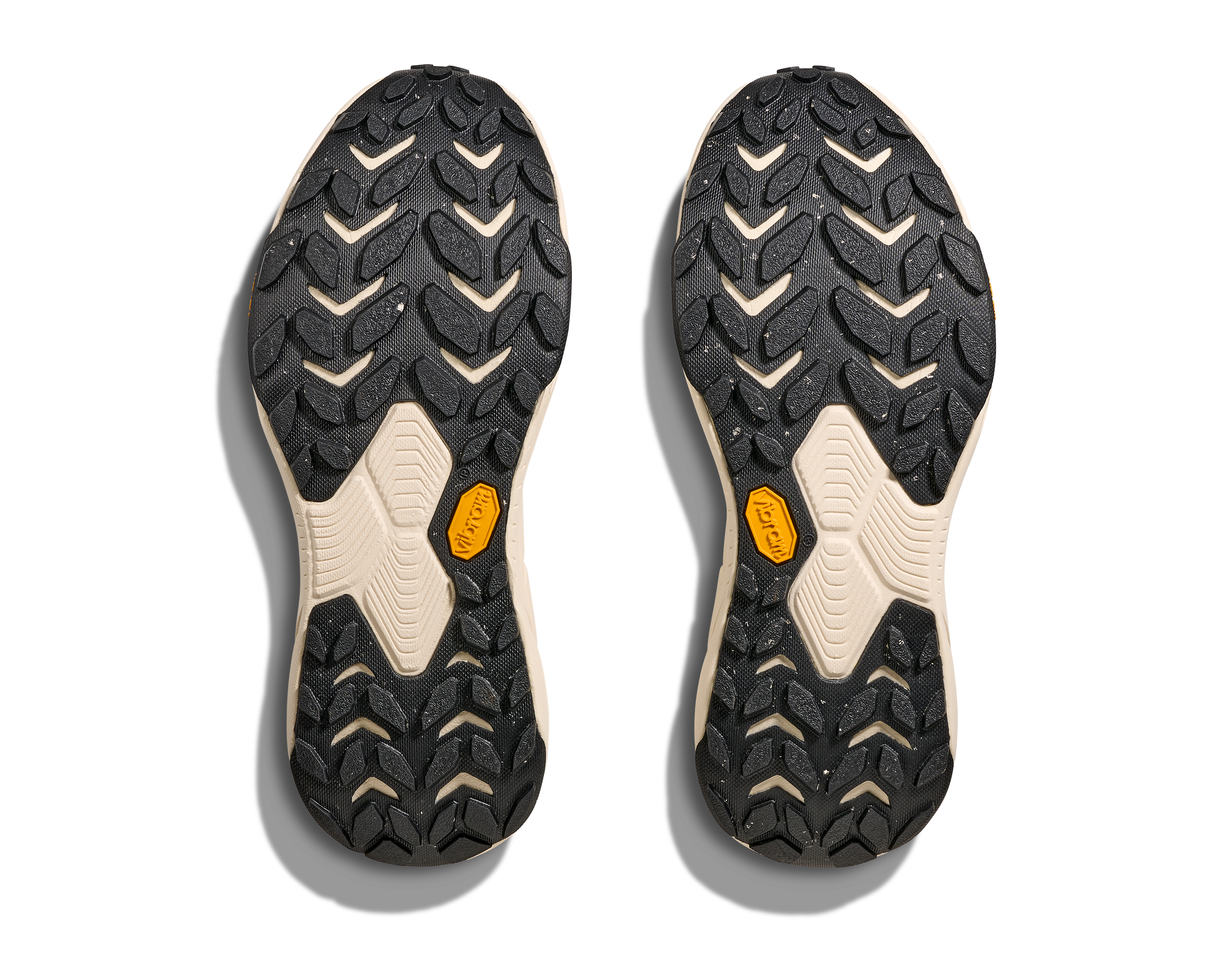 Close-up of a pair of black and beige shoe soles